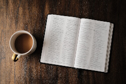 Open Bible and a cup of coffee